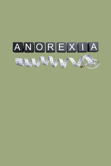 Symbolbild: Anorexie Schriftzug mit Maßband als Symbol für Essstörung